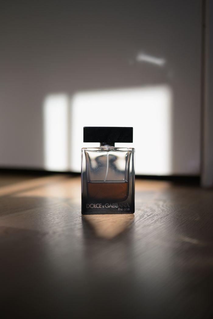 why-choose-us-img Luxury perfume bottle basking in soft sunlight indoors, showcasing elegance.
